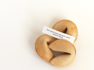 A fortune to take to heart, resting on top of three fortune cookies
