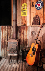 Rustic fireplace with guitar