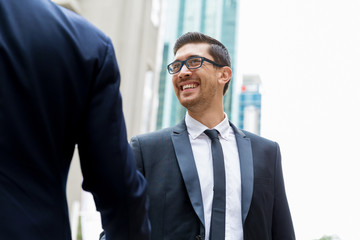 Two businessmen shaking their hands