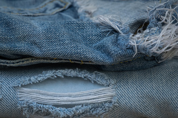 Closeup stack of old jean, Worn old jean