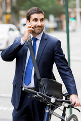 Young businessmen with a bike