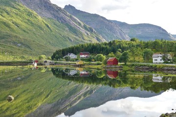 Fototapeta na wymiar Mountains reflecting over clear water in the Lofoten Islands, Norway
