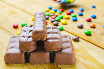 multi-colored candies on a wooden background