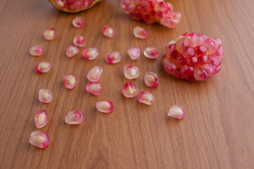 Ripe pomegranate fruit on wooden background