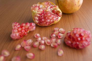 Ripe pomegranate fruit on wooden background