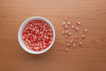 Ripe pomegranate fruit on wooden background