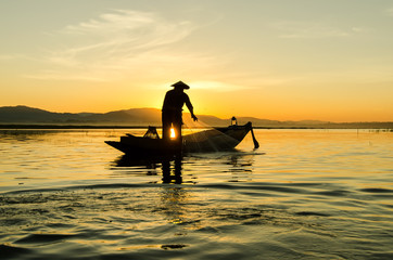Fishermen at sunset
