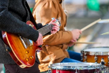 Music street performers on autumn outdoor. Middle section of body part with guitar. © Gennadiy Poznyakov