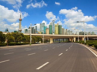 Obraz premium Empty road surface with shanghai bund city buildings