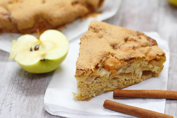 Homemade apple pie, fresh apples and cinnamon