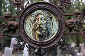 Historic Jesus on the mystery old Prague Cemetery, Czech Republic