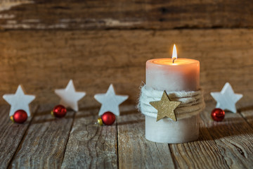 Christmas background burning candle and stars