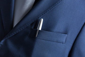 Pen in pocket of a business suit close up
