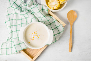 hot corn soup in a white bowl
