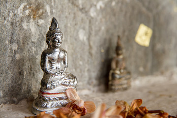 Very small plastic statue of the Buddha
