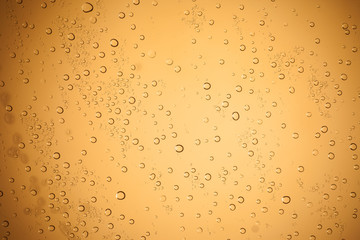 Water droplets on brown glass for a background, Raindrops on bro