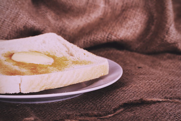 Slices of toast against a rustic background Vintage Retro Filter
