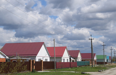 Obraz premium The roof of corrugated sheet on the houses