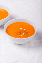 Homemade vegetable cream soup with bread on a bright background, closeup, selective focus