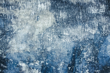 Grunge cold color scratched concrete wall background.