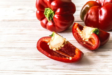 Red bell pepper on wooden background. Harvest