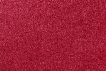 Light red leather texture background. Closeup photo.