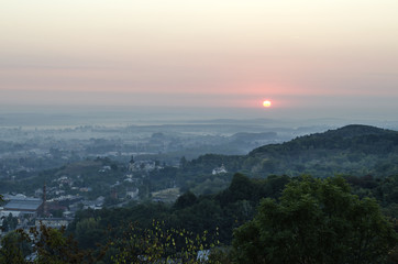 Fototapeta premium Sunrise over the city. View of the City from the High Castle, Lviv, Ukraine 