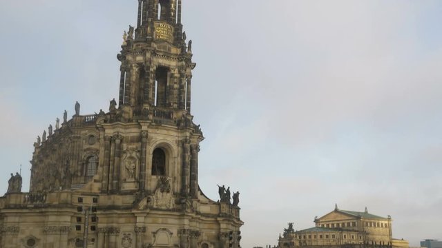 Tilt down Katholische Hofkirche with Theaterplatz and Semperoper in the background. Dresden Germany