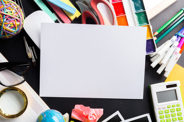 Desk of an artist with lots of stationery objects