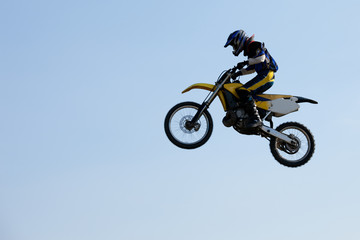 Fototapeta na wymiar Motocross rider jumping