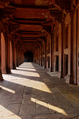 Walk down the red passage in the mosque in Fatehpur Sikri, India.