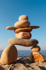 Figurine of stones on coast