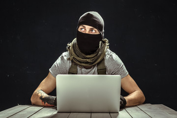Terrorist working on his computer