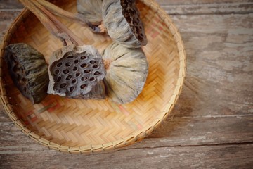 Lotus seed on wooden background ,soft focus and retro style.Copy space.