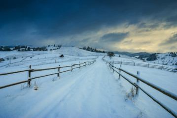 Fototapeta na wymiar Road through the winter valley