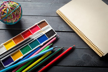 School tools. On a wooden background.