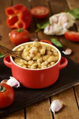 potaje de garbanzos, a spanish chickpeas stew, on a wooden table