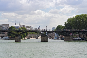 Fototapeta premium tourists on the seine bridge Pont des Arts in Paris