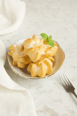 profiteroles with cream and powdered sugar