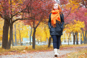 girl walking in city park, autumn season