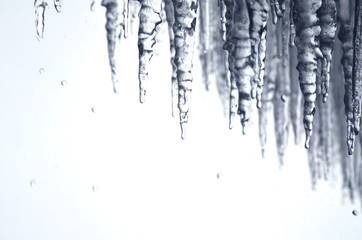 Cold icicles dripping with water behind Niagara Falls