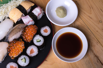 Fototapeta na wymiar Japanese seafood sushi set on wood