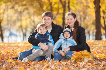 Fototapeta premium Happy family in the autumn park