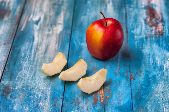 Apple On Old Blue Patina Board With Three Slices