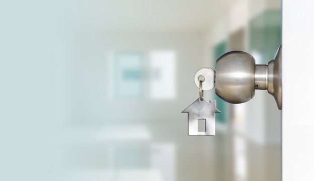 Open door with keys of house 