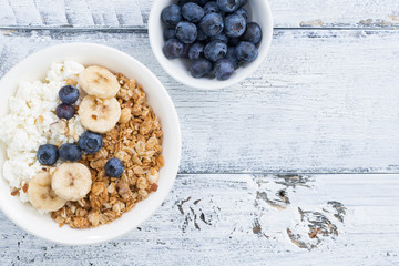 Healthy breakfast with cottage cheese, muesli and fresh fruit