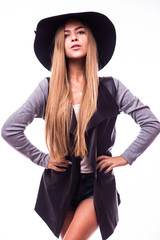 Fototapeta premium Beautiful young woman wearing summer black hat with large brim