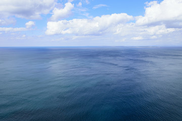 Naklejka na ściany i meble Atlantic ocean and blue cloudy sky, Aran islands