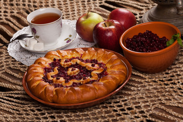 Pie on the table with food set