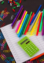 School supplies frame on chalkboard background